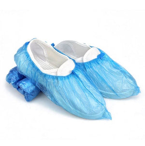 Medizinische, blaue Überschuhe aus Plastik