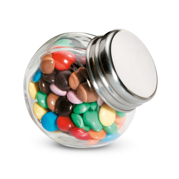 Lentilles en chocolat dans un distributeur en verre