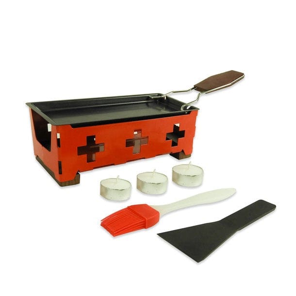 Rotes Tischraclette mit Schweizerwappen Design, Kerzen, einem Pinsel und einem Schaber