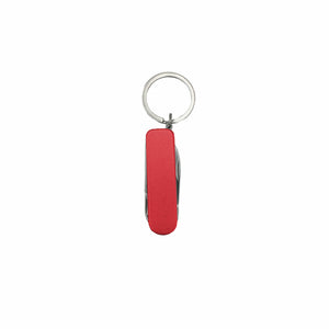 Eingeklappter, roter Nagelclipper und Schlüsselanhänger