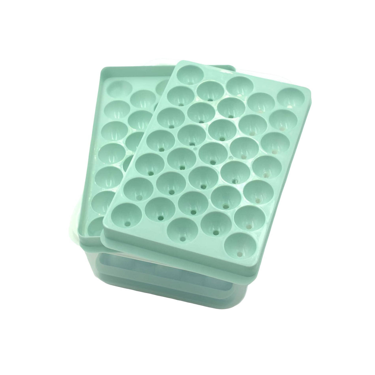 Grüne Eiswürfelform mit transparenter Plastikbox