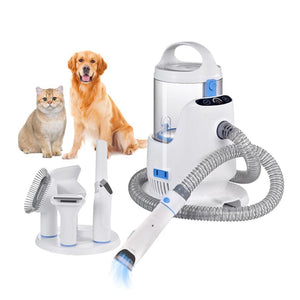 Weisse Hundeschermaschine mit weissem Tierhaar-Staubsauger mit einem Hund und einer Katze im Hintergrund