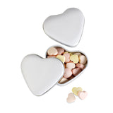 Heart-shaped tin with candies